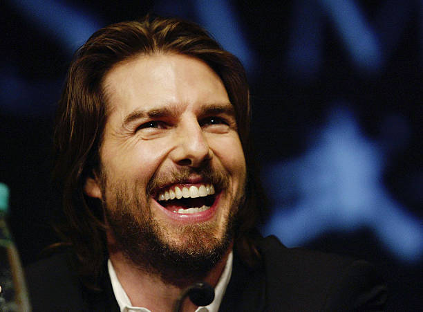 NEW PLYMOUTH, NEW ZEALAND - JANUARY 11:  Actor/Producer Tom Cruise laughs as he speaks to the media during a press conference to promote the film "The Last Samurai" at the Theatre Royal on January 11, 2003, New Plymouth, New Zealand. Set in 1870's Imperialist Japan, the film depicts the destruction of the Samurai. Tom Cruise plays civil war veteran Captain Woodrow Algren. Directed by Edward Zwick, most of the film currently in production is shot in New Plymouth at a budget of around $100 million dollars. (Photo by Simon Baker/Getty Images).