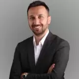 dr-onur-erdem-smiling-with-hands-folded.jpg